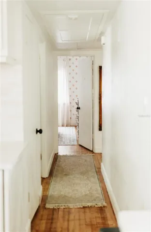 Hall off of kitchen, leading to pantry & hall bath