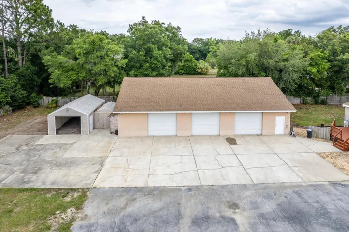 Three outbuildings include a 64x40 air-conditioned block garage that can accommodate up to 12 vehicles.