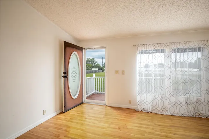 Step into the large living room with vaulted ceilings for a spacious feel.
