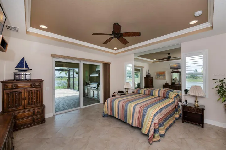 master suite with private pool access and stunning lakefront views