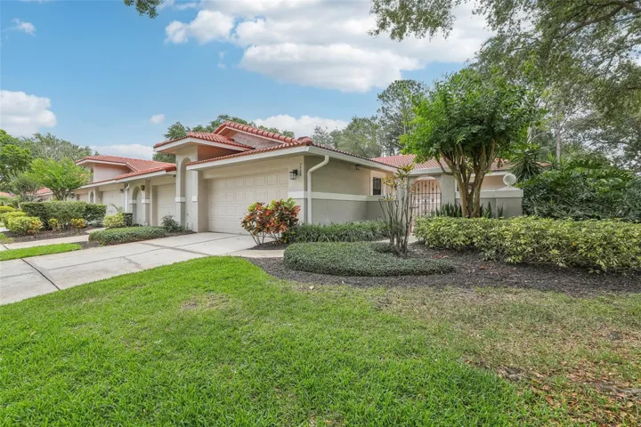 LOCATION, LOCATION, LOCATION!! Live the LIFE OF LUXURY at an AFFORDABLE PRICE in the HEART OF DR. PHILLIPS in the EXTREMELY SOUGHT AFTER, LOW MAINTENANCE, GATED TOWNHOUSE Community of SANDPOINTE! This BEAUTIFUL END UNIT TOWNHOUSE had a NEW TILE ROOF installed in 2021, has been FRESHLY PAINTED, has a NEW WATER HEATER from 2022, and was VERY ELEGANTLY and TASTEFULLY RENOVATED in 2019 with QUARTZ COUNTERTOPS in the KITCHEN and in BOTH BATHROOMS, NEW KITCHEN CABINETS, STAINLESS STEEL Kitchen Appliances and a TOTAL REMODEL of the PRIMARY BATHROOM that includes a REDESIGNED OVERSIZED SHOWER with FRAMELESS GLASS DOORS, NEW FLOORING and NEW VANITIES, NEW FIXTURES AND QUARTZ COUNTERTOPS as well!