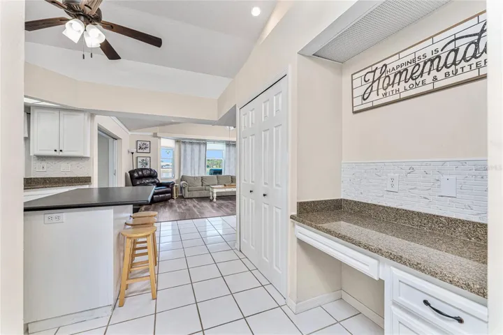 Built In Desk In The Kitchen provides a spot to make out your grocery list!