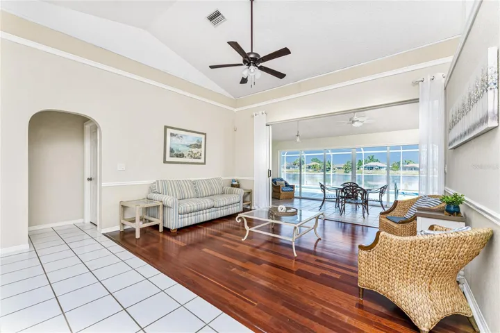Living Room Has Views Into The Florida Room and on out to the Pool!