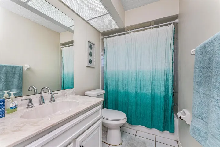 Guest Bath Has A Large Vanity And combo tub/shower.