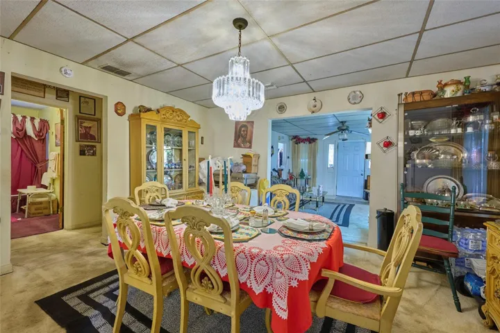 Kitchen is located beyond the dining room
