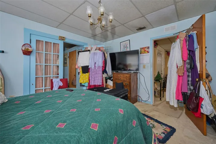 French doors lead to the master bathroom