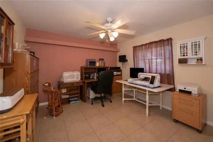 1 of 2 auxiliary bedrooms, being used as sewing/craft/quilting/embroidery room.