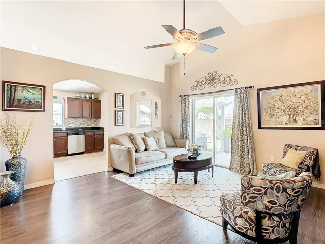 Open floor plan with the living room having a view of the pergola and back yard.