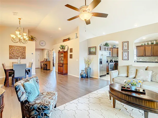 Living room, dining room and arched way leads to the kitchen.