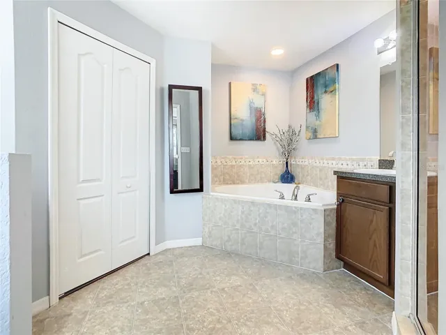 Master Bathroom has soaking tub and walk-in shower.