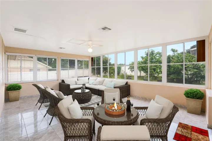 The enclosed Florida room gives you additional flexible space! Virtually Staged.