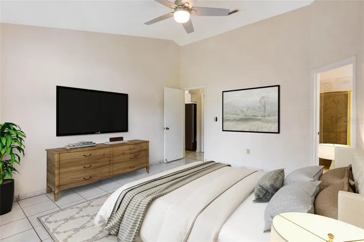The three bedrooms include a generous PRIMARY SUITE with another vaulted ceiling, WALK-IN CLOSET and private en-suite bath where you can relax and unwind at the end of a long day. Virtually Staged.