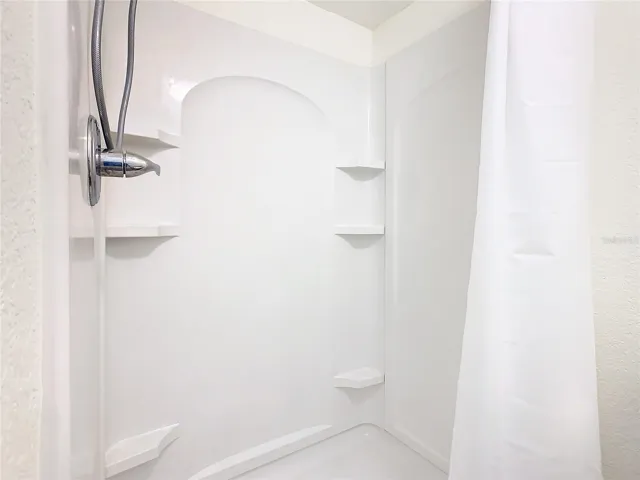 Bathroom has walk-in shower.