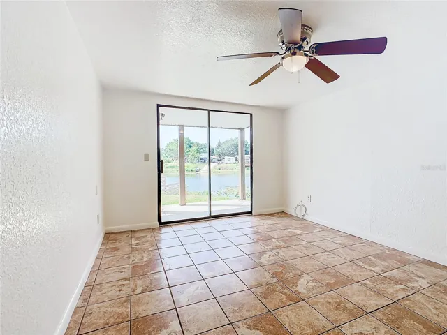 Master Bedroom has sliding glass doors that open onto the back covered patio.