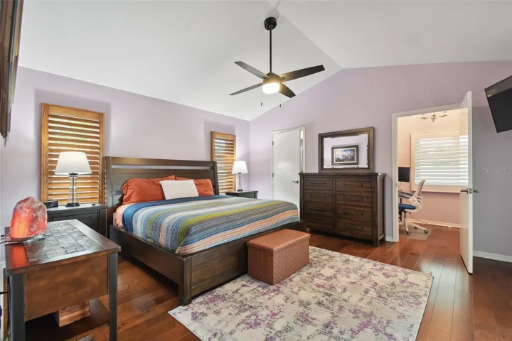 Master bedroom with dual closets, one is currently being used as an office space.