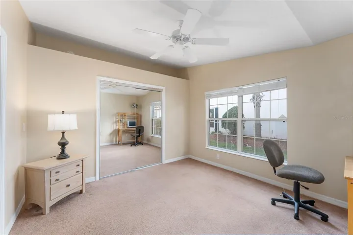 Guest Bedroom with double doors and mirrored closet doors