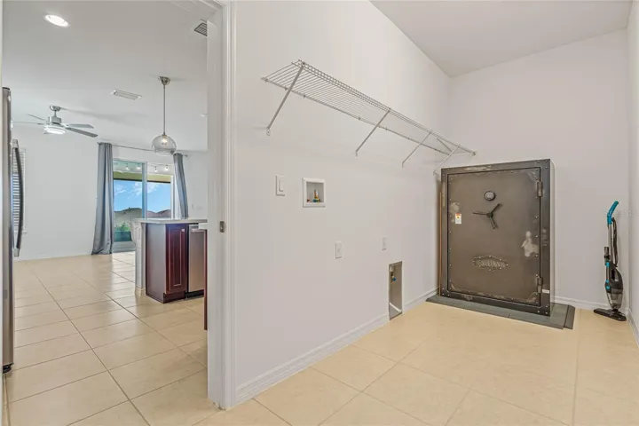 EXPANDED LAUNDRY ROOM-FIREPROOF SAFE IS AN OPTIONAL PURCHASE