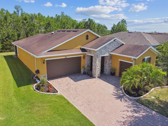 Striking Stone Facade with large driveway and separate golf cart garage!