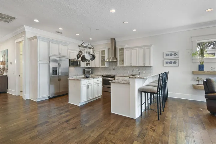 Kitchen with breakfast bar and island