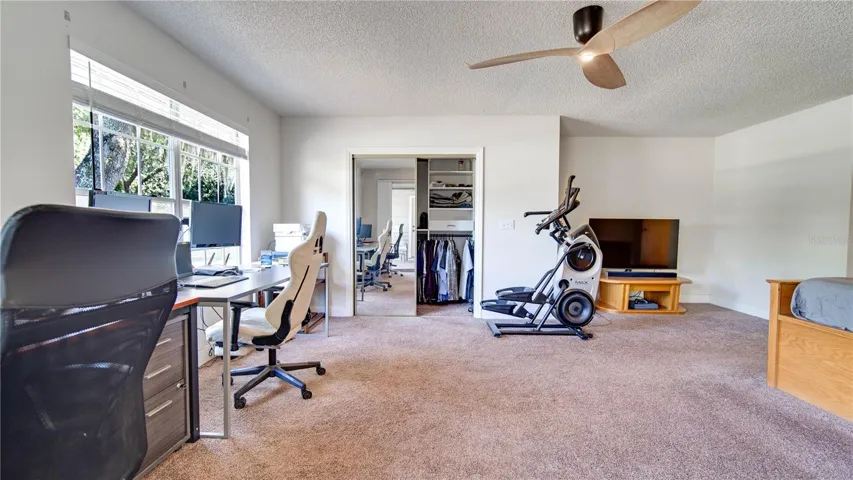 Master Bedroom w/ screened door connects to lanai/backyard
