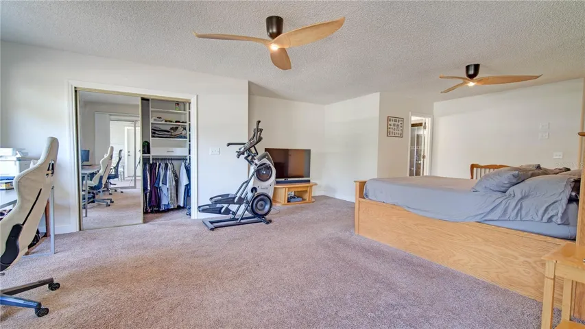 Master Bedroom w/ screened door connects to lanai/backyard