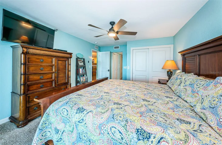 ...  Shot Taken From Balcony Sliders  Looking In Towards Master Bedroom.. Extra Closet Behind White Panel  Doors. Open Door on left to Living Room Area  --- Open Doorway to Master Bathroom Suite.