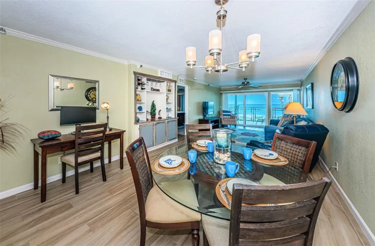 ... Dining Room Looking Out to Living Room and Gulf ... Well Laid out Condo.. Plenty of Storage and Closet Space. Knick Knack or Dry Bar Area on Left in Photo..