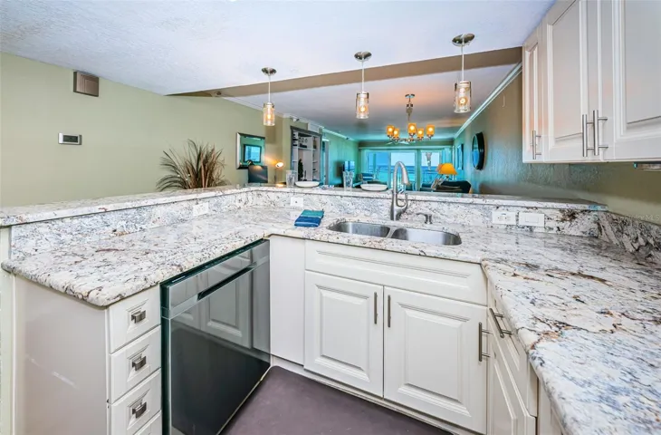 ... Kitchen Shot Towards Dining Room Area.. Large 1300 Sq Foot Unit with 32 Feet from Breakfast Bar to Balcony Sliders.. Lots of Room to Relax.. Condo Has A Well Laid Out Floorplan ..