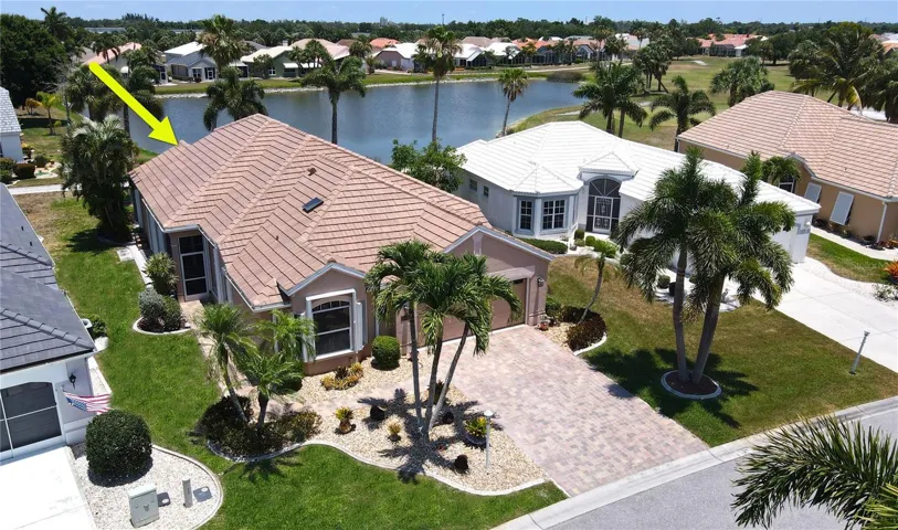 Aerial view of home and lake