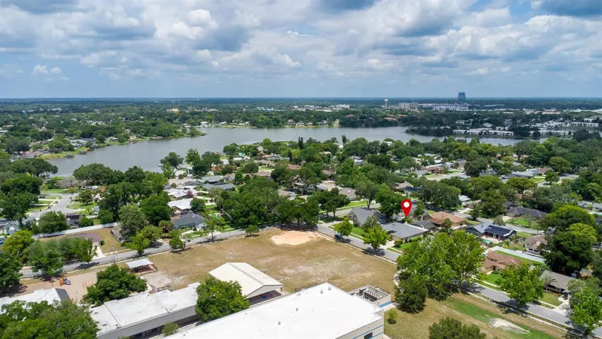 Drone view of Home, Lake Orienta and School.