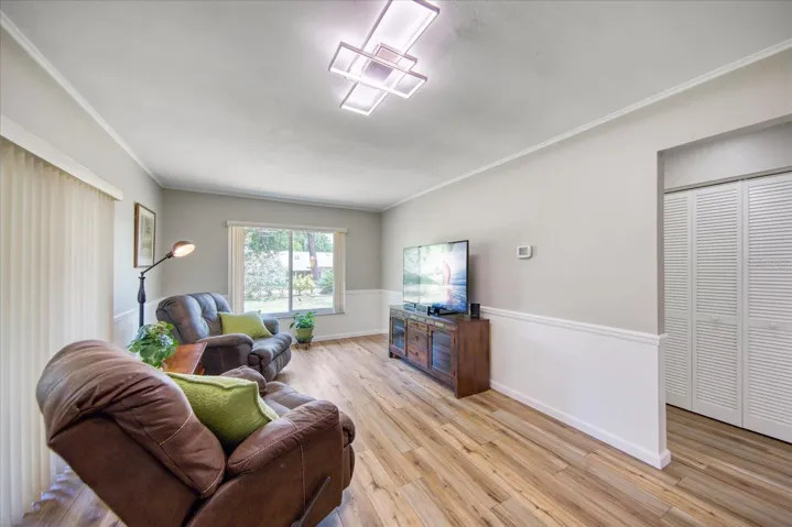 Family room is open to kitchen with beautiful views of newer landscaping & fruit trees offering privacy between rear neighbors~