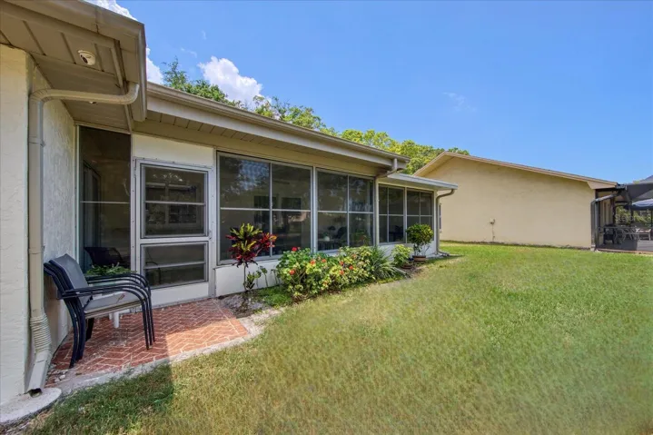 The landing off the Florida room can be expanded if a larger patio is desired~