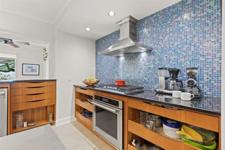 New granite countertops and chic backsplash for a sleek look.
