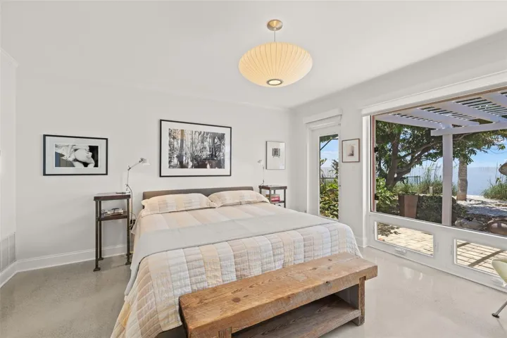 Experience the comfort of this primary bedroom with water view. The home features 3 spacious bedrooms.