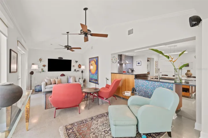 Lovely vaulted ceiling features ceiling fans and makes the space greater to enjoy.