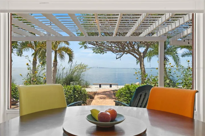 Welcome to your dream home, and soak in the magnificent 180-degree water views from many rooms, including your dinning room table.