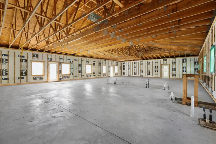 Unfinished home on property attached to horse barn