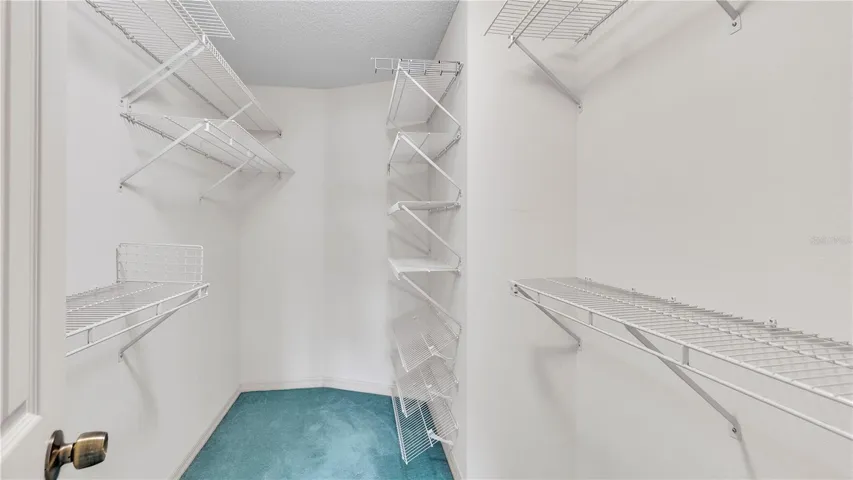 Enormous Walk-In Closet with lock key entry