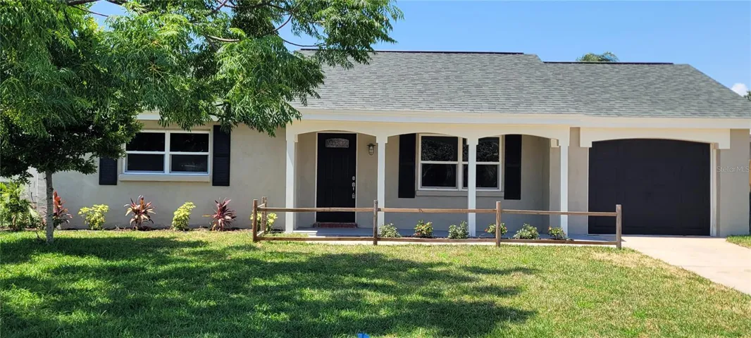 New Citrablue sod and landscaping. Home has stucco finish on all sides and fresh paint
