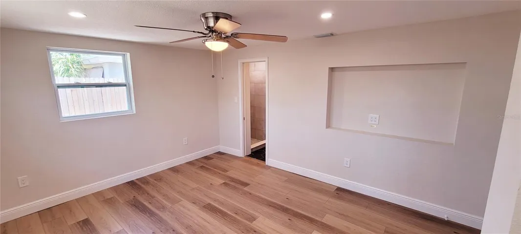 Master bedroom with ensuite bathroom. Also a built-in TV niche