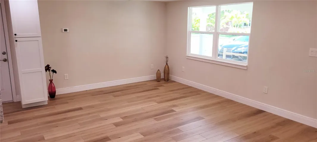 Open living room with pantry cabinet-all new windows