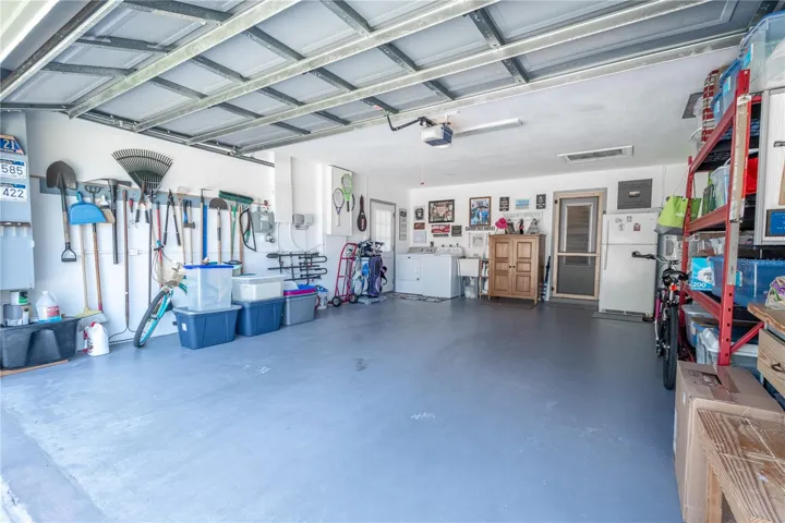 The garage features an automatic door opening, a place to hang your yard tools and addition storage shelves. Washer/Dryer Hook-ups in garage.