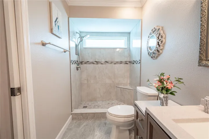 The primary bath features gorgeous tile flooring complimented by the wall color.