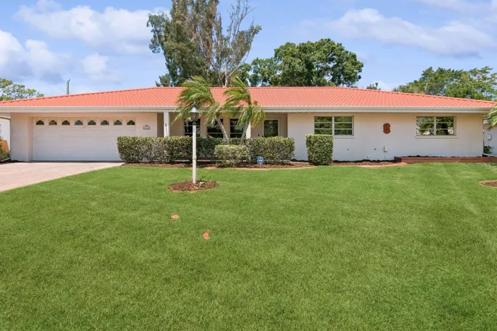 The red metal roof and tidy exterior provided lovely curb appeal.