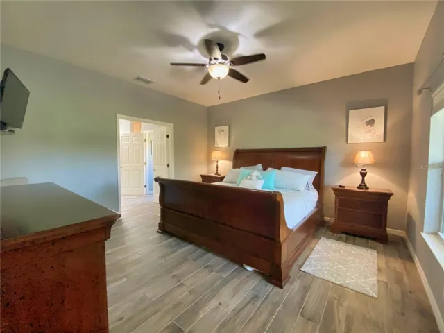 Primary Bedroom with Tile Plank Flooring