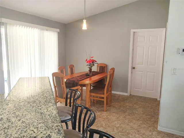 dining area opens to sliding glass doors to lanai