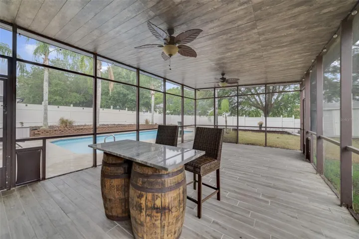 AMAZING SCREENED IN PATIO OFF POOL AREA