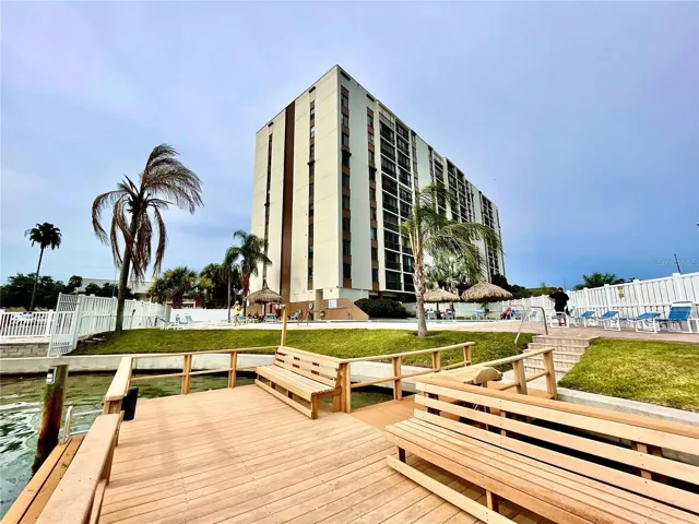 Largo dock on water looking onto pool area and Southwest side of the building.