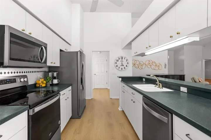 Updated stainless appliances looking into laundry room