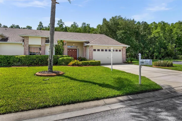 Alternate View of Front Of Home Looking at yard adjacent to cut-de-sac.